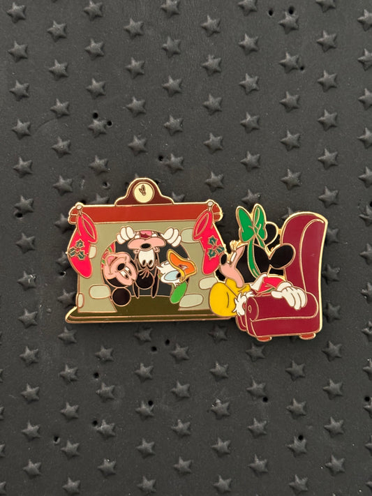 Minnie sitting by the fireplace Christmas Auctions pin